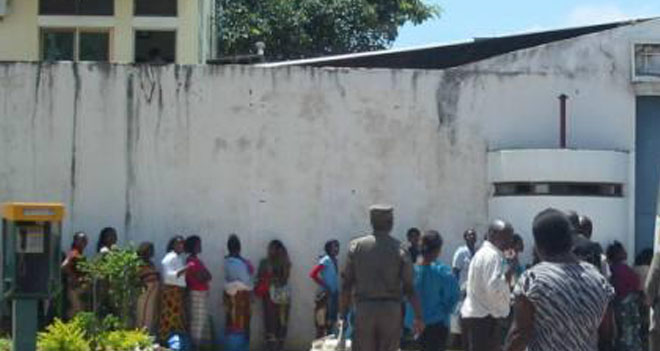 Visitors queue outside Maputo Central