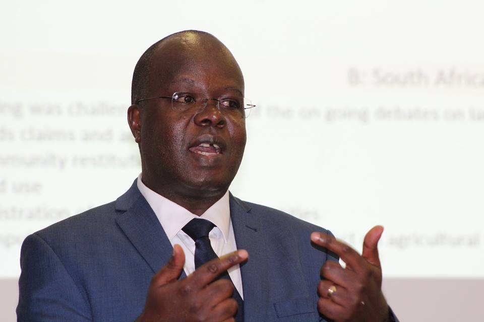 Dr Douglas Singiza sharing the reflections of 18 months of investigation of the Commission of Inquiry into Land in Uganda.